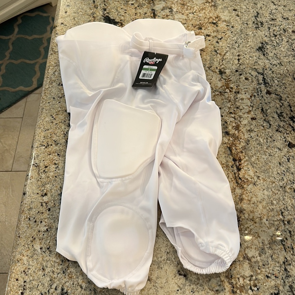 RAWLINGS FOOTBALL PANTS NWT. Adult large. Never worn.